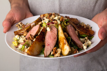 salad with duck, cheese and nuts.