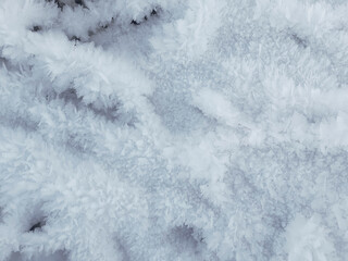 The snow texture. Snowflakes. Frozen water crystals. Needle relief. Frost. Fluffy cover. Winter...