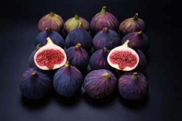 Tasty figs on a black background. Top view.