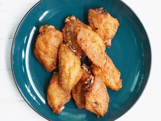 fried chicken wings Crispy Drumsticks chicken wing fried on tissue paper absorbed oil