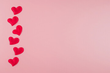 Valentine's day concept with hearts on a pink background. Flat lay, copy space