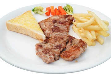 Roast beef and fresh vegetables on a white plate horizontal top view white background
