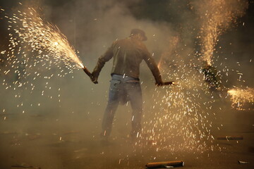 2018. KALAMATA, GREECE: The tradition of Saitopolemos in KAlamata, where men light homemade fireworks. The tradition was stopped when a cameraman lost his life after a firework hit his head in 2019.