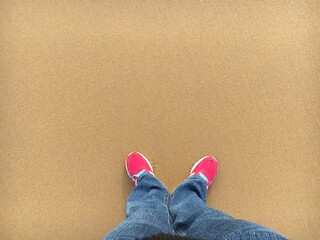 Fototapeta na wymiar feet on the sand