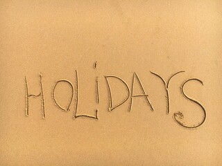 the inscription on the sand Holidays 