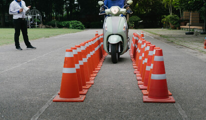 Man is learning to ride a bike . Biker beginner on a motorcycle.