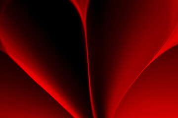 colored abstract lines made of paper macro photo on a black background