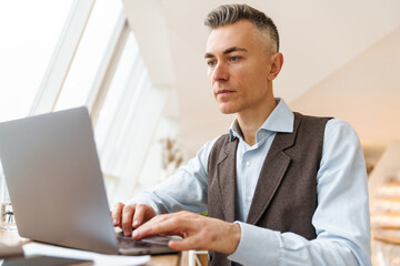 Confident handsome businessman in smart clothes