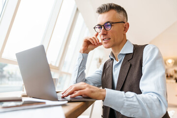 Confident handsome businessman in smart clothes