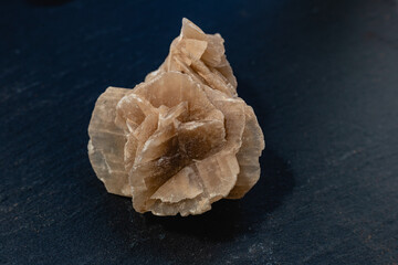 Desert rose, natural sand stone on dark background
