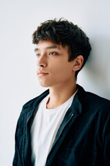 Fototapeta premium Close up portrait of young mixed race man on white studio background