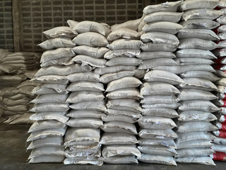 Chemical fertilizer The product stock is packed in sacks, stacked in the warehouse, waiting for delivery.	