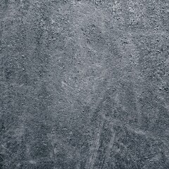 Textured surface with scratches, stripes, abrasions. Abstraction with light and dark paint. Square wallpaper.