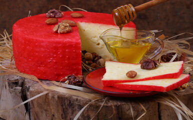 Cheese and nuts on a wooden table