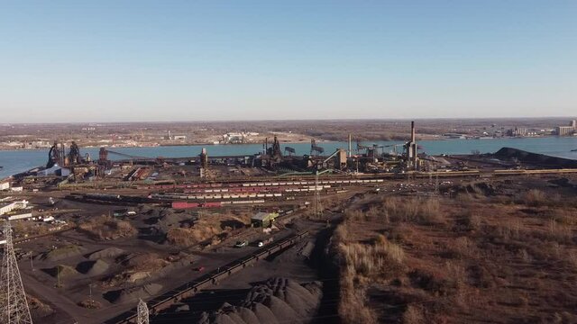 The Windsor Hum - Pile Of Petroleum Coke Used For Industrial Plant At Zug Island Near Detroit River In Detroit, Michigan. - aerial