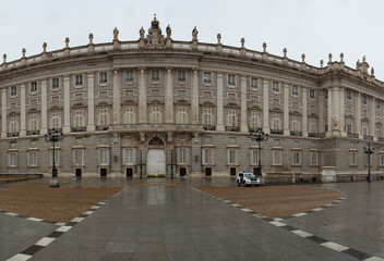 Fototapeta na wymiar Heritage. Monumental architecture and design. Panorama view of the Royal Palace of Madrid baroque facade in Madrid, Spain.