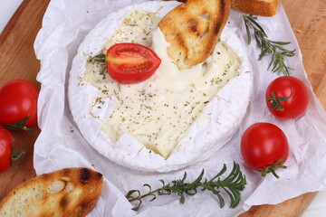 Camembert with grilled baguette and tomatoes