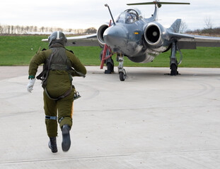 Blackburn, Hawker Siddley Buccaneer. Pilot runs towards his waiting Cold War bomber, ready for a...