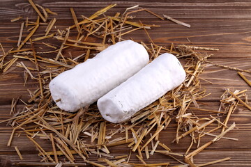 Cheese with white mold. Saint-Mor-de-Touraine on the straw.