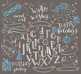 Hand drawn alphabet and decorative elements set in white and blue