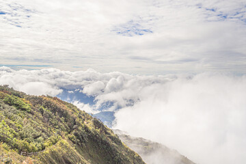 Beautiful scenic view of mountains and clouds against the sky in Kew Mae Pan nature trail at Doi Inthanon, Chiang Mai, Thailand. Famous tourist attractions of Thailand. Concept of holiday and travel