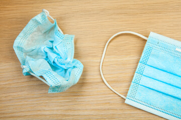 image of face mask wooden desk background 