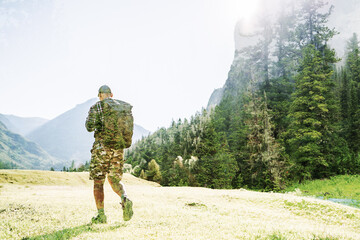 hiker in camouflage hiking