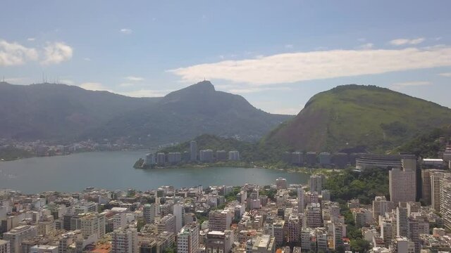 drone flight over  Ipanema Beach in Rio de Janeiro distant view of Lagoa lake distant view of crist