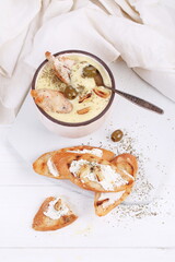 French puree soup with parsnip, soft cheese baguette. Holds a soft cheese sandwich