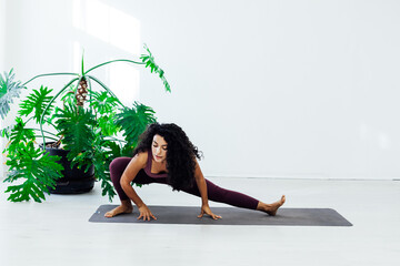 Beautiful woman yoga asana engaged in fitness gym