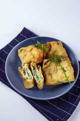 Martabak telur mini, Indonesian street food. fried wrap filled with eggs,minced meat, and vegetables.