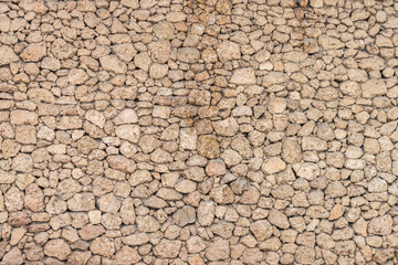 Old stone masonry. Background image of a historical wall. Stone wall from Sandstone. The ancient construction.