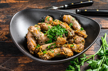 Stew with Chicken Neck meat and vegetables. Dark wooden background. Top view