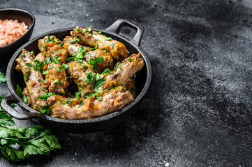 Stew with Chicken Neck meat and vegetables. Black background. Top view. Copy space