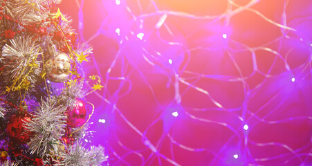 Christmas tree with toys, balls, garlands and lights, new year background. Place for text. Copy space