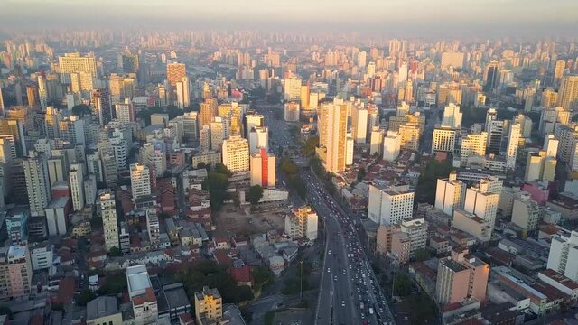 flight over City centre Of Sao Paulo, near big avenue at sunset