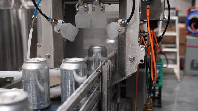 Beer cans getting spray washed