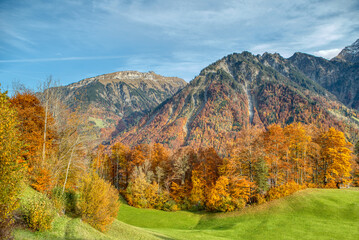Charming autumn landscape in Swiss Alps. Colorful autumn scene of Swiss Alps. Location: Linthal, Canton Glarus, Switzerland, Europe