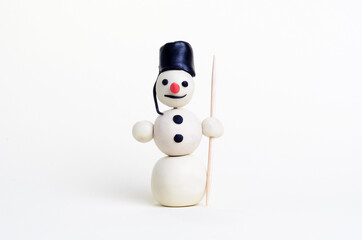 Fairy snowman made of plasticine on a white background