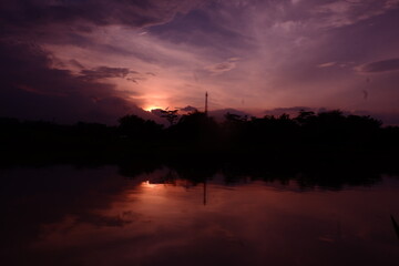 Fototapeta premium sunset over the river