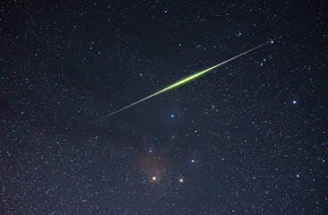 Beautiful starry sky.The huge bright meteor flying on the night sky. Astronomical background.