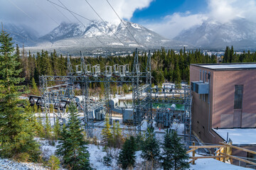 Fototapeta na wymiar Rundle hydro power plant Canmore in the Canadian Rockies in winter season sunny day morning. Canmore, Alberta, Canada.