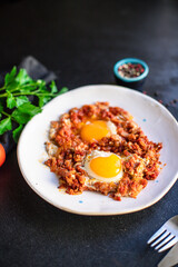 fried eggs with tomato and vegetables shakshuka omelette natural organic snack ready to eat on the table healthy meal snack top view copy space for text food background rustic keto or paleo diet