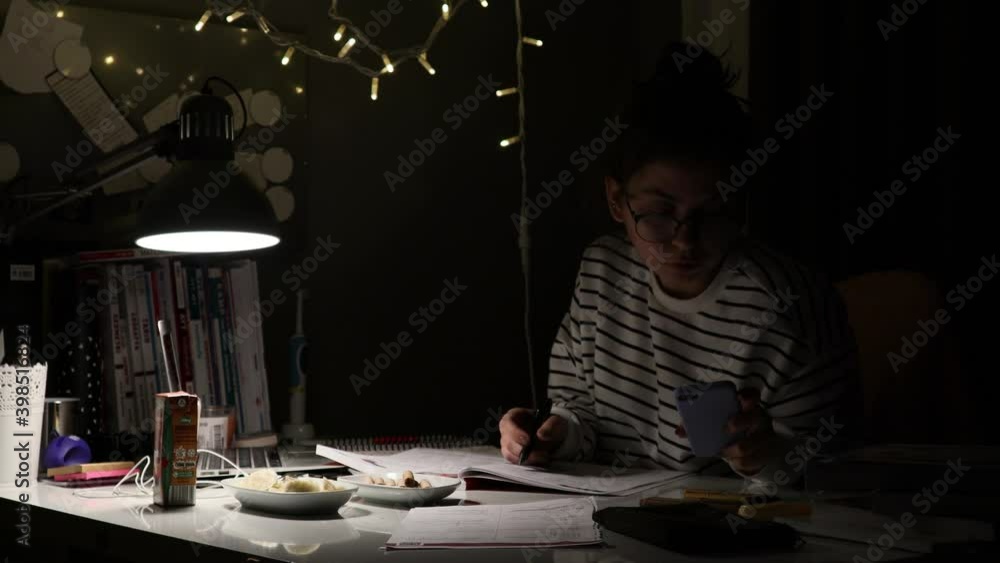 Poster Student studying for the exam at the desk. With computer and textbooks. Time lapse. Close-up focus. university entrance exam in Turkey.