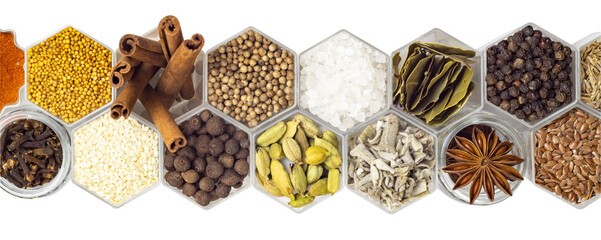 Spices in hexagonal jars isolated on a white background