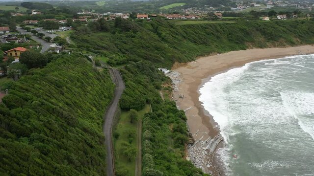 aerial shot of ocean green coast in the south west of France during a cloudy day with wind.