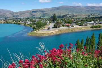 Central Otago town of Cromwell on bend in turquoise  Clutha River in Central Otago New Zealand.