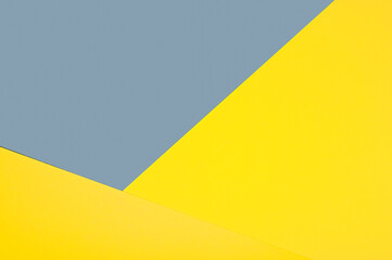 Demonstrating trendy colors 2021 - Gray and Yellow. Paper geometric background with copy space.