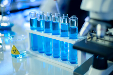 Row of blue liquid chemical tube in laboratory, Science and technology healthcare concept