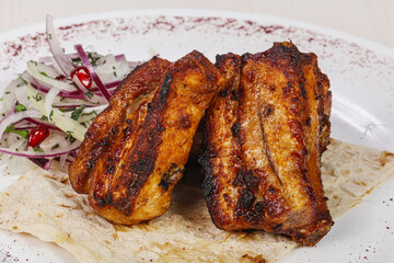 Grilled pork steak with bone